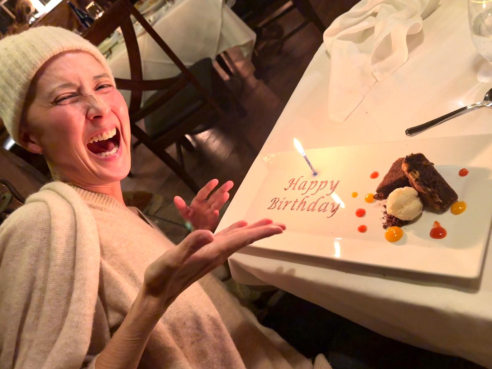 Lisa laughing over a birthday dessert