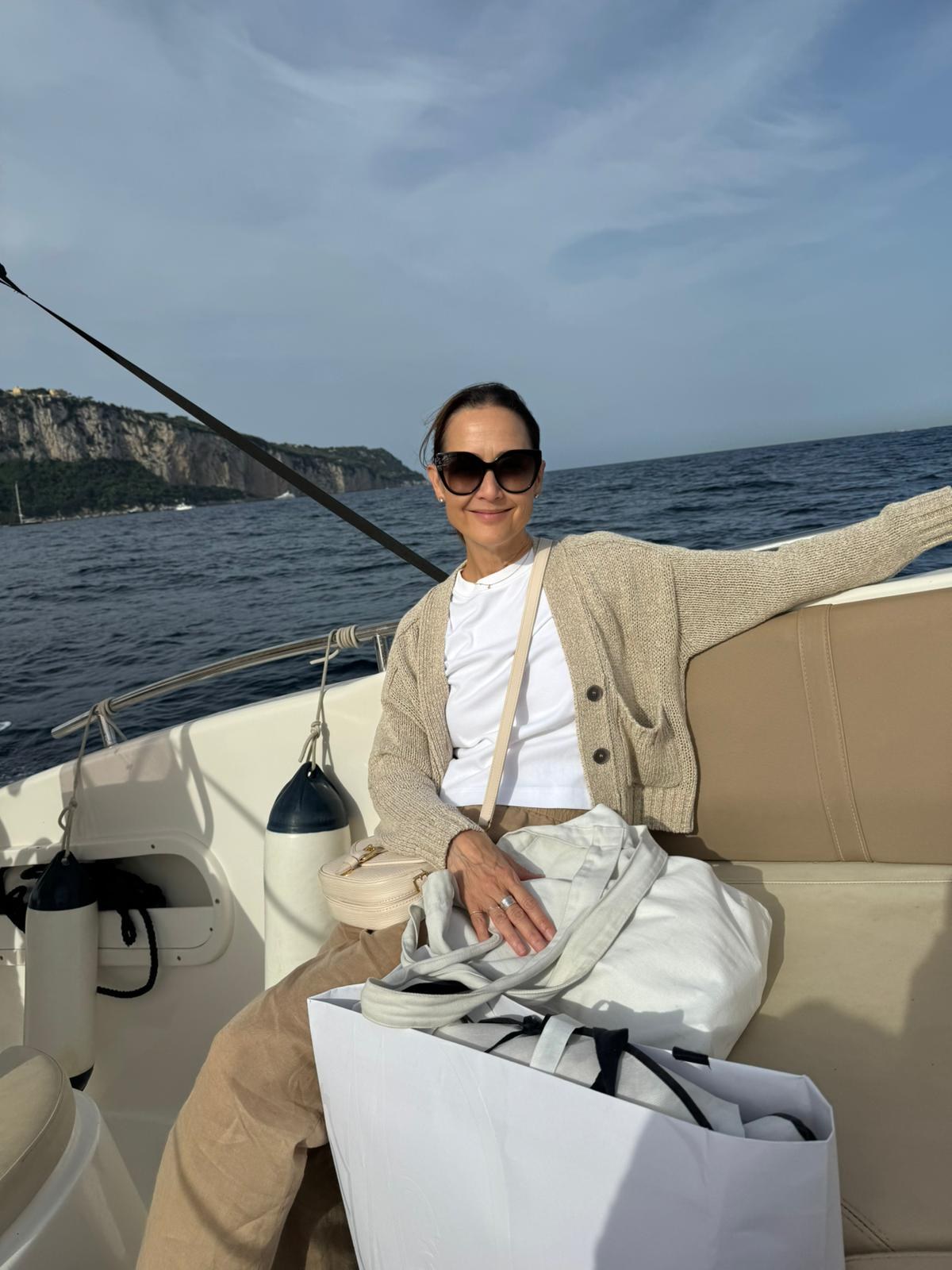 Lisa seated on a boat