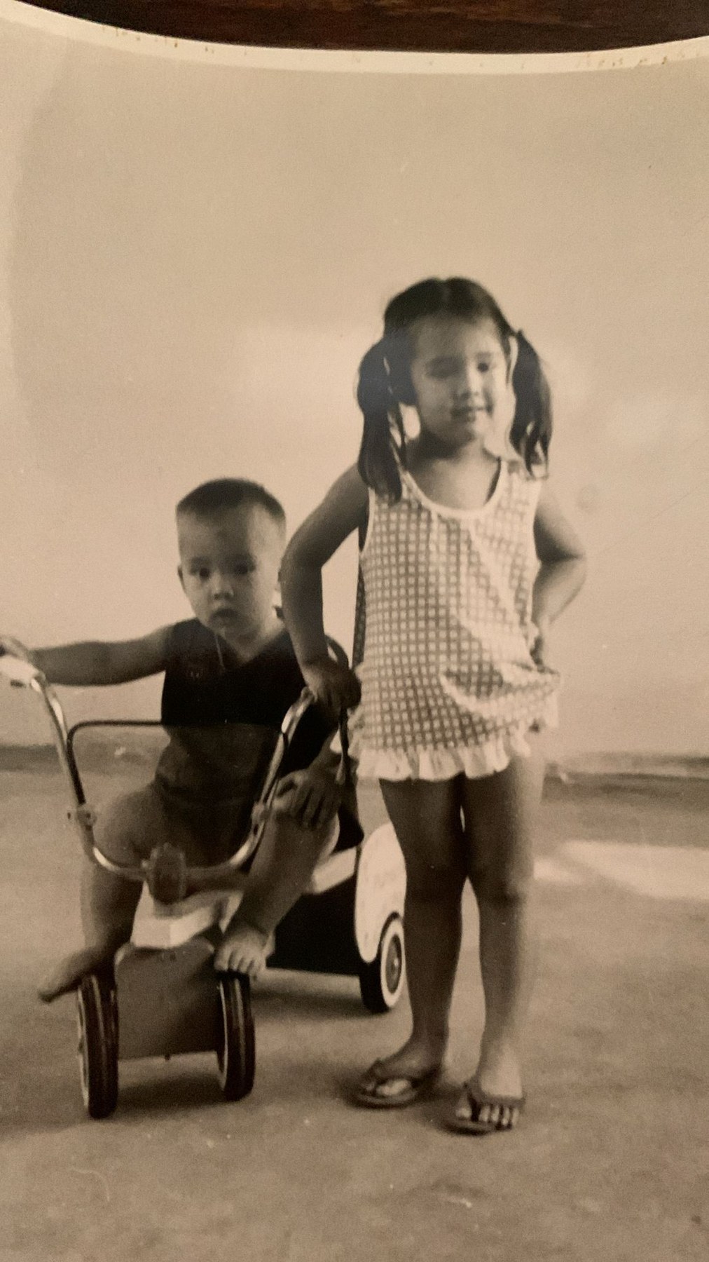 A childhood photograph with a tricycle