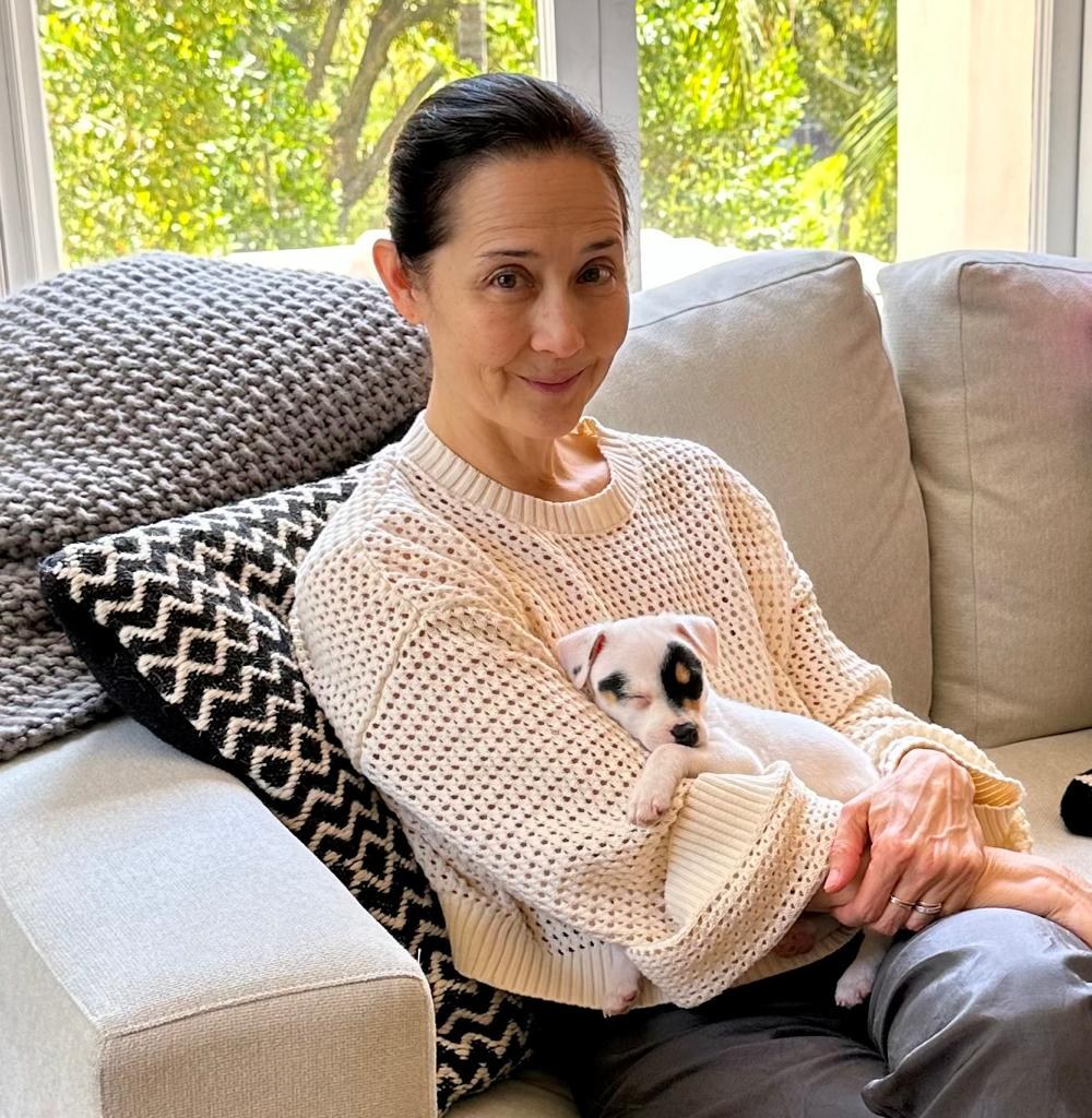 Lisa holding a small puppy