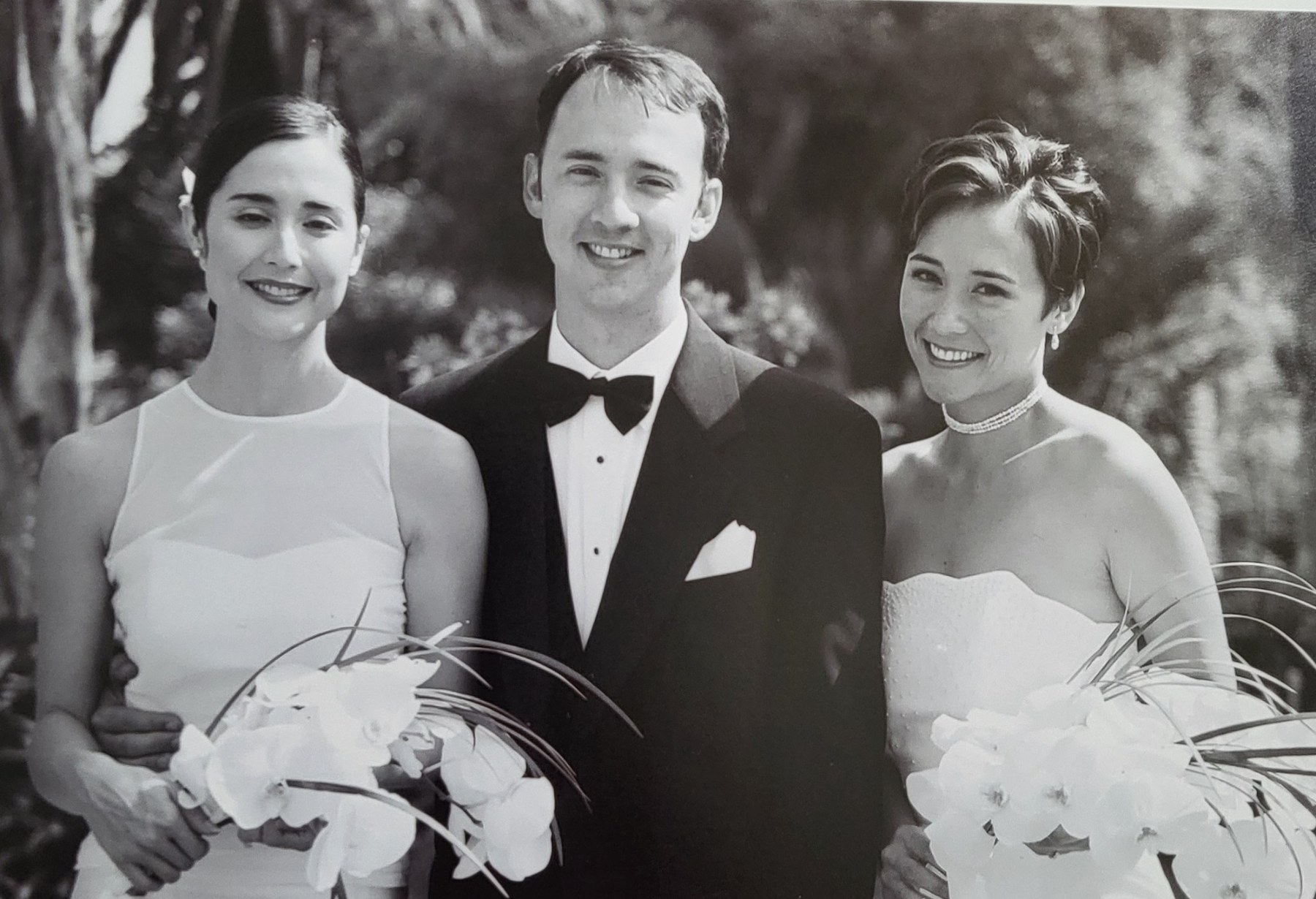 A black-and-white wedding portrait