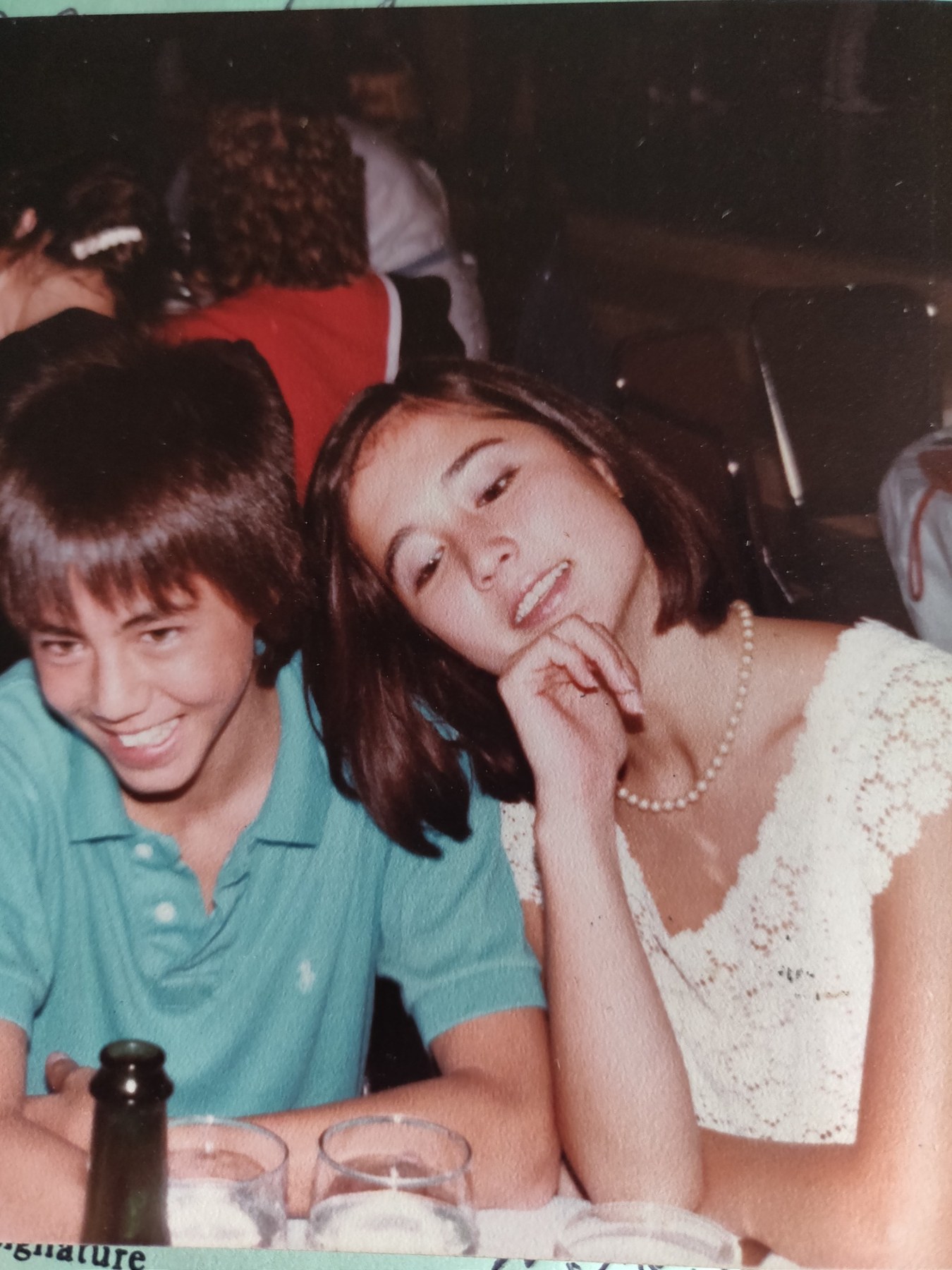 A youthful candid photograph at a table