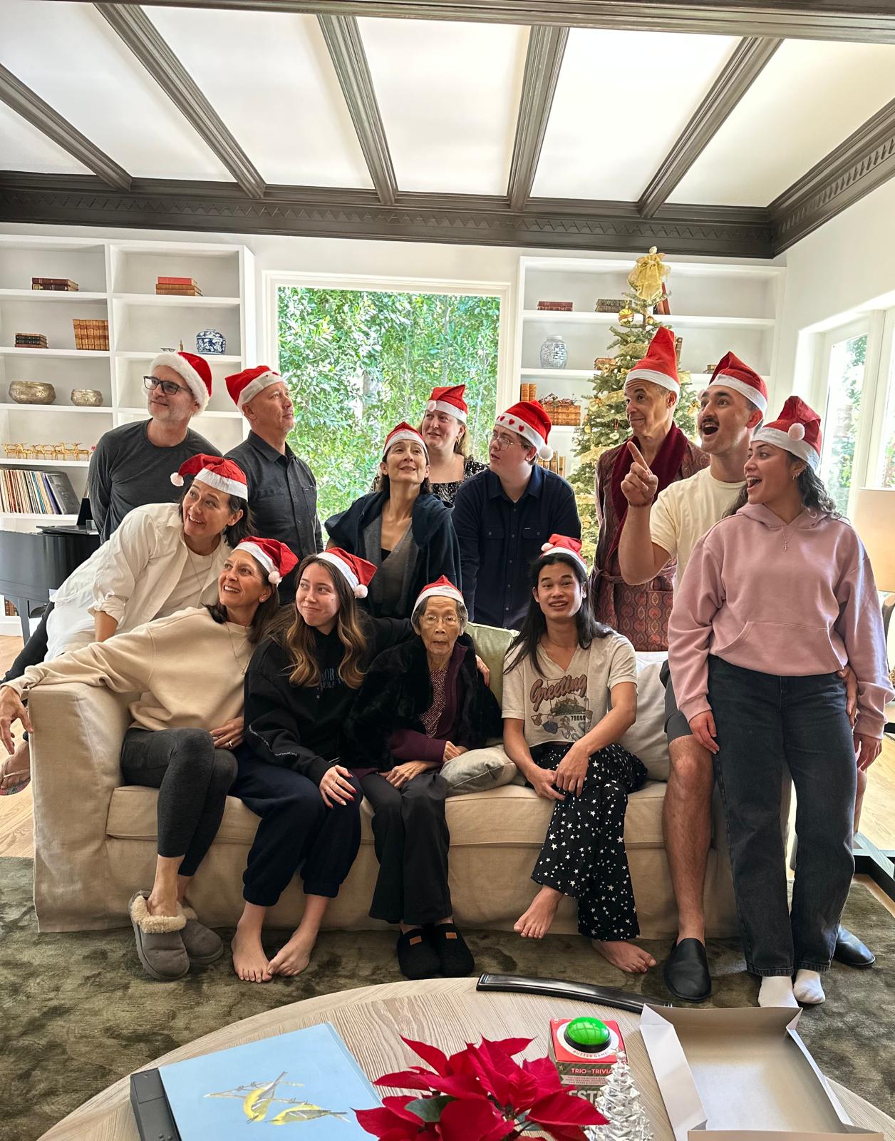 Family wearing holiday hats at Christmas